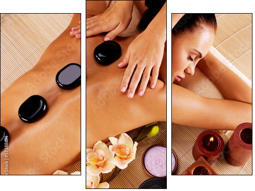 Adult woman having hot stone massage in spa salon - Three-piece canvas, Triptych