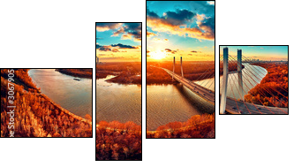Beautiful panoramic aerial drone view to cable-stayed Siekierkowski Bridge over the Vistula river and Warsaw City skyscrapers, Poland in gold red autumn colors in November evening at sunset - Four-piece canvas, Fortyk