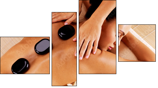 Adult woman having hot stone massage in spa salon - Four-piece canvas, Fortyk