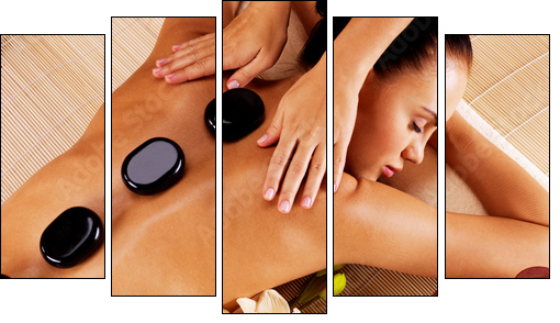 Adult woman having hot stone massage in spa salon - Five-piece canvas, Pentaptych